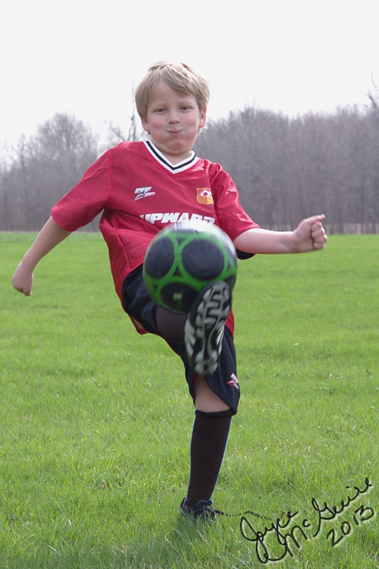 Adrian kicking ball
